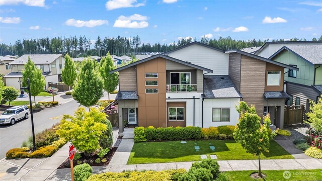32867 Madrona Ave SE, Black Diamond, WA 98010 - view of front of property featuring a residential view, a front lawn, a shingled roof, and a balcony