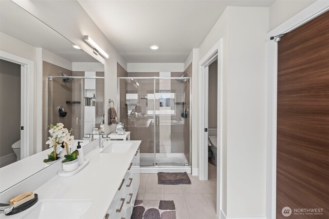 32867 Madrona Ave SE, Black Diamond, WA 98010 - full bathroom with double vanity, a shower stall, and tile patterned flooring