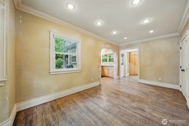 1126 E Alder St, Walla Walla, WA 99362 - empty room featuring crown molding, healthy amount of natural light, wood finished floors, baseboards, and recessed lighting