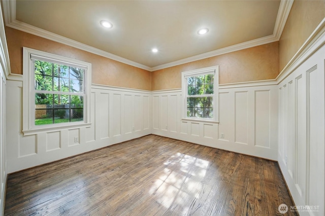 1126 E Alder St, Walla Walla, WA 99362 - spare room with a decorative wall, plenty of natural light, wood finished floors, a wainscoted wall, and ornamental molding