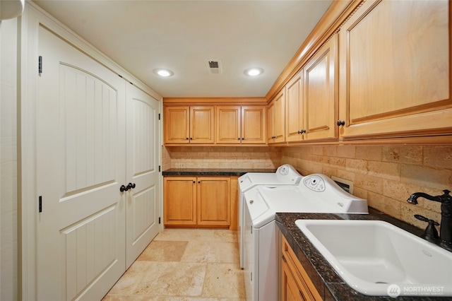 1126 E Alder St, Walla Walla, WA 99362 - laundry room featuring cabinet space, independent washer and dryer, recessed lighting, and light stone finish flooring