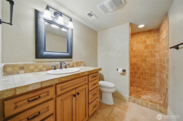 1126 E Alder St, Walla Walla, WA 99362 - full bath featuring a tile shower, toilet, vanity, and stone tile floors