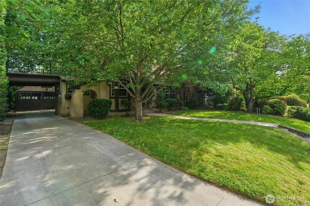 1126 E Alder St, Walla Walla, WA 99362 - obstructed view of property with driveway, a front lawn, and stucco siding