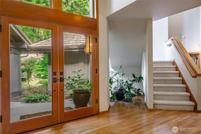 5419 Quail Run, Blaine, WA 98230 - doorway to outside featuring french doors, wood finished floors, stairs, and plenty of natural light