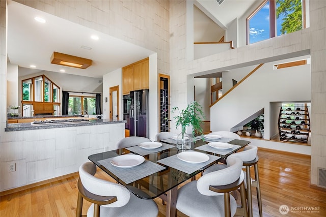 5419 Quail Run, Blaine, WA 98230 - dining room featuring light wood finished floors and a towering ceiling