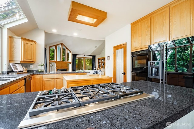 5419 Quail Run, Blaine, WA 98230 - kitchen featuring black appliances, lofted ceiling, light brown cabinets, a peninsula, and tile countertops