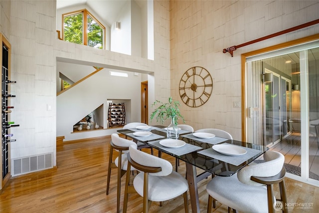 5419 Quail Run, Blaine, WA 98230 - dining area with light wood finished floors, a high ceiling, and baseboards