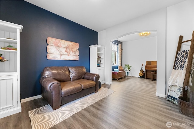 15315 91st Ave SE, Yelm, WA 98597 - living area featuring arched walkways and wood finished floors