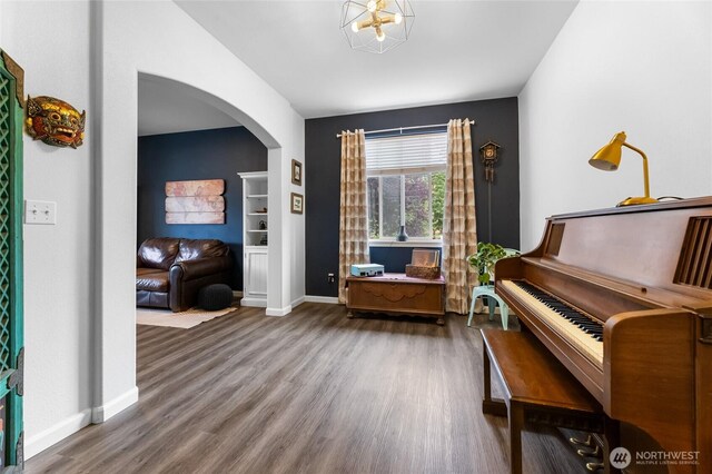 15315 91st Ave SE, Yelm, WA 98597 - living area featuring arched walkways, wood finished floors, and built in shelves