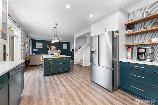 15315 91st Ave SE, Yelm, WA 98597 - kitchen with appliances with stainless steel finishes, open shelves, white cabinets, light countertops, and recessed lighting
