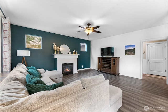 15315 91st Ave SE, Yelm, WA 98597 - living room with a ceiling fan, dark wood finished floors, and a glass covered fireplace
