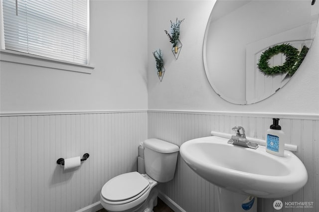 15315 91st Ave SE, Yelm, WA 98597 - half bathroom featuring a sink and wainscoting