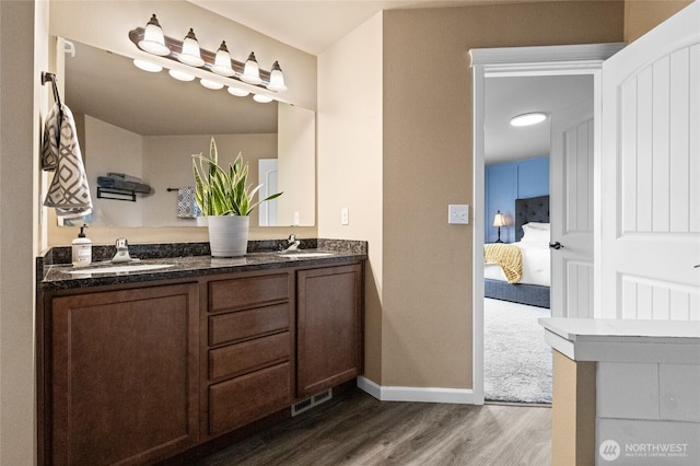 15315 91st Ave SE, Yelm, WA 98597 - ensuite bathroom with wood finished floors and double vanity