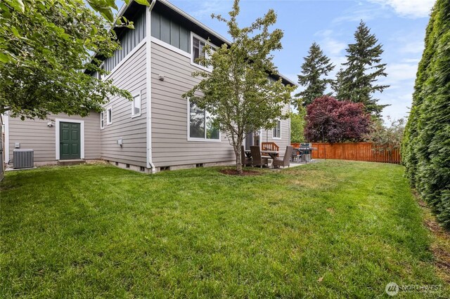15315 91st Ave SE, Yelm, WA 98597 - back of property with board and batten siding and a patio area