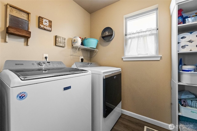 15315 91st Ave SE, Yelm, WA 98597 - washroom featuring washing machine and dryer and dark wood-style floors