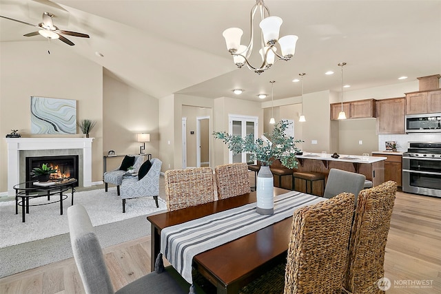 7391 Mirasett St SW Lot 42, Tumwater, WA 98512 - dining area with a ceiling fan, a chandelier, recessed lighting, light wood finished floors, and lofted ceiling