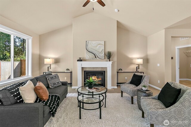 7391 Mirasett St SW Lot 42, Tumwater, WA 98512 - living room with a ceiling fan, a tiled fireplace, light carpet, baseboards, and high vaulted ceiling