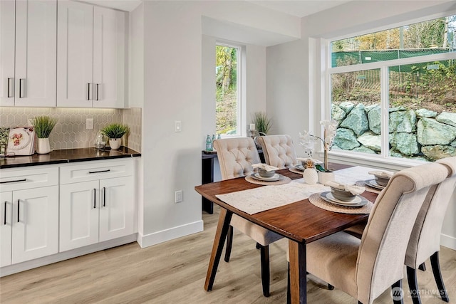 6726 NE 187th St Unit 102, Kenmore, WA 98028 - dining space with light wood finished floors and baseboards