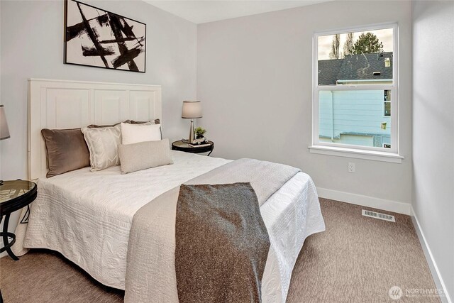 6726 NE 187th St Unit 102, Kenmore, WA 98028 - bedroom with baseboards and carpet