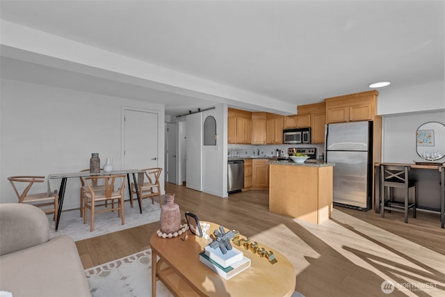 1601 Taylor Ave N Unit 303, Seattle, WA 98109 - living room featuring light wood-style flooring