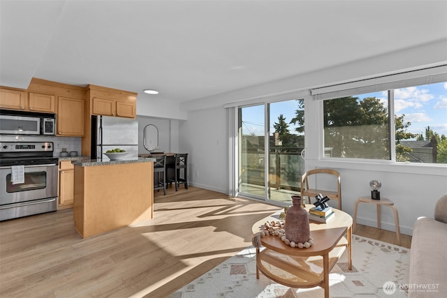 1601 Taylor Ave N Unit 303, Seattle, WA 98109 - living area featuring light wood-type flooring and baseboards