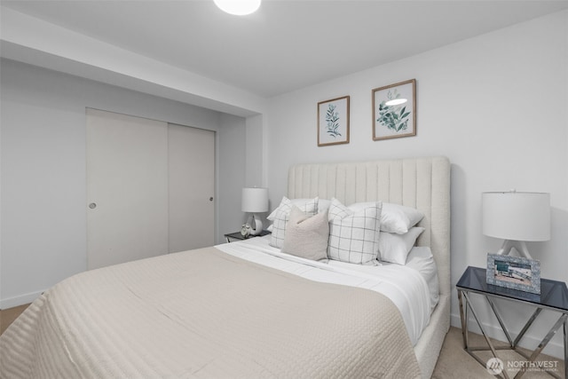 1601 Taylor Ave N Unit 303, Seattle, WA 98109 - carpeted bedroom with baseboards and a closet