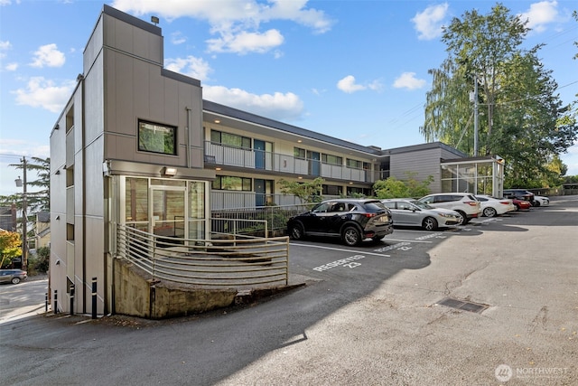 1601 Taylor Ave N Unit 303, Seattle, WA 98109 - view of building exterior featuring uncovered parking