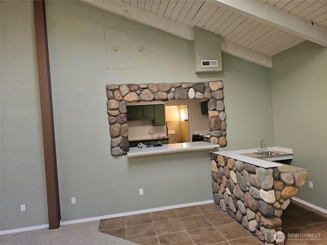 20025 Carper Rd SW, Rochester, WA 98579 - kitchen with green cabinetry, wooden ceiling, dark tile patterned flooring, a sink, and baseboards