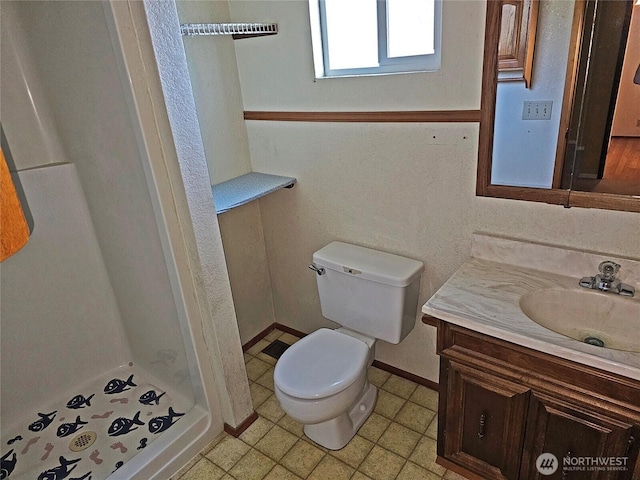 20025 Carper Rd SW, Rochester, WA 98579 - full bathroom with vanity, a stall shower, toilet, and baseboards