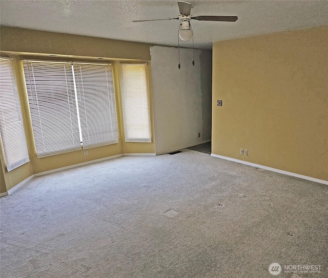 20025 Carper Rd SW, Rochester, WA 98579 - unfurnished room with ceiling fan, carpet, and baseboards