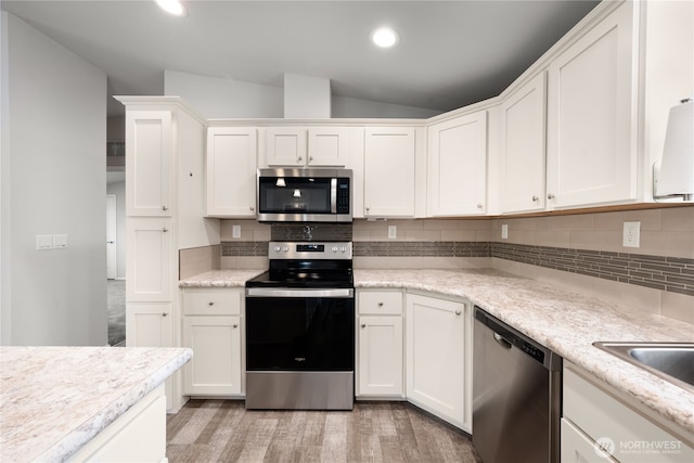 133 Broad St W, Bremerton, WA 98312 - kitchen featuring appliances with stainless steel finishes, white cabinets, lofted ceiling, and recessed lighting