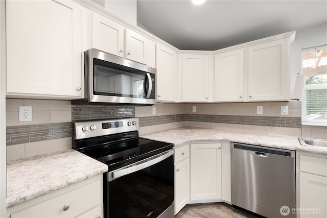 133 Broad St W, Bremerton, WA 98312 - kitchen featuring stainless steel appliances and white cabinetry