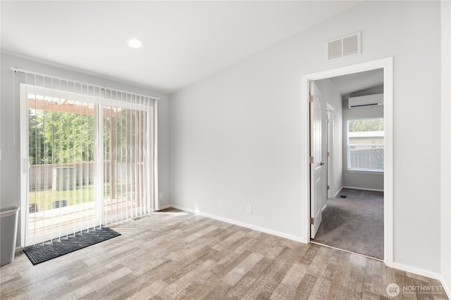 133 Broad St W, Bremerton, WA 98312 - spare room featuring an AC wall unit, wood finished floors, and recessed lighting