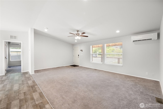133 Broad St W, Bremerton, WA 98312 - unfurnished living room with a wall mounted air conditioner, healthy amount of natural light, a ceiling fan, recessed lighting, and carpet flooring