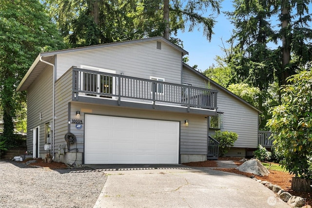 10008 50th Pl W, Mukilteo, WA 98275 - view of front of home featuring a balcony, driveway, and an attached garage