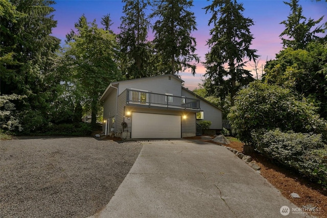 10008 50th Pl W, Mukilteo, WA 98275 - view of front of property with concrete driveway, a balcony, and a garage