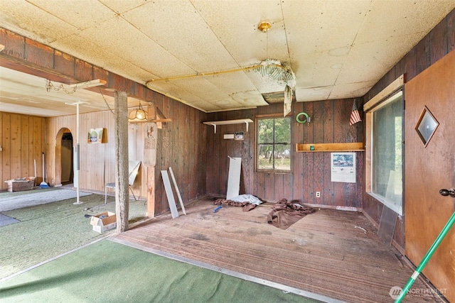 1921 Taylor St, Centralia, WA 98531 - misc room featuring wood walls, arched walkways, and carpet