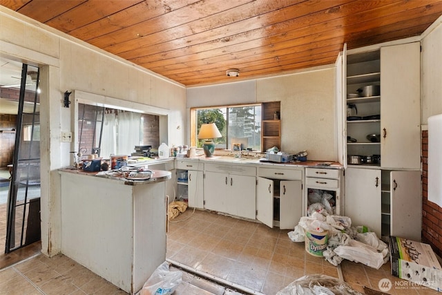1921 Taylor St, Centralia, WA 98531 - kitchen with wood ceiling, white cabinets, and light tile patterned floors