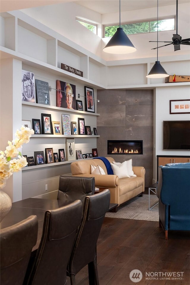 11116 SE 4th St, Bellevue, WA 98004 - living room featuring dark wood-style floors, a tile fireplace, and built in shelves