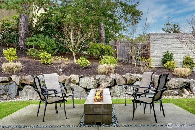 11116 SE 4th St, Bellevue, WA 98004 - view of patio / terrace with an outdoor fire pit