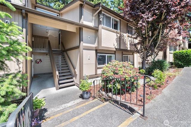 4721 176th St SW Unit G7, Lynnwood, WA 98037 - view of property featuring stairs and uncovered parking