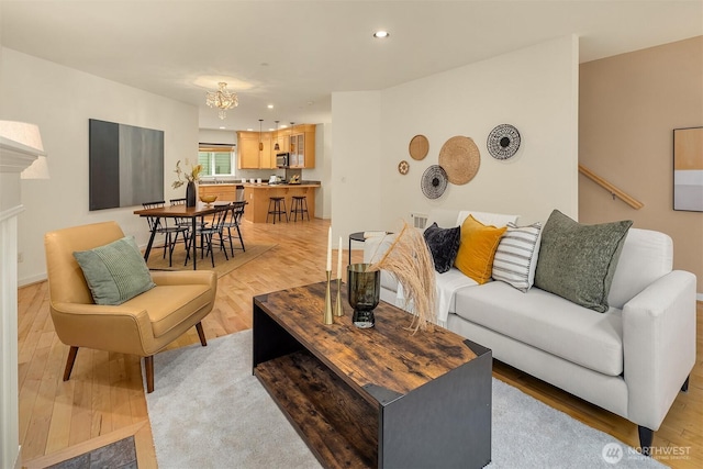7321 47th Ave SW Unit B, Seattle, WA 98136 - living area featuring a chandelier, light wood-type flooring, recessed lighting, and a fireplace