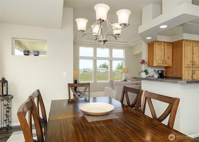 155 Triopha Ln, Sequim, WA 98382 - dining area featuring a chandelier, dark wood-style floors, recessed lighting, and a tray ceiling