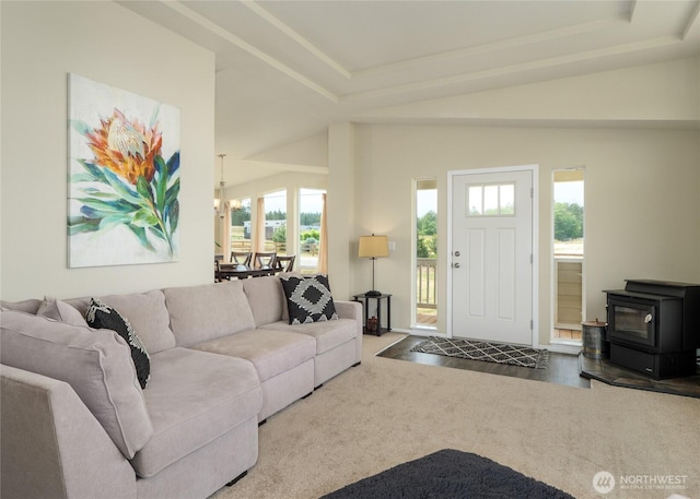 155 Triopha Ln, Sequim, WA 98382 - living room with plenty of natural light, a wood stove, carpet, and a raised ceiling