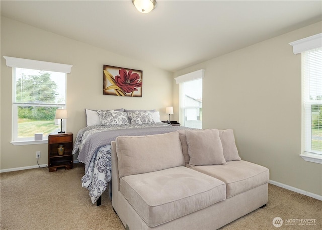 155 Triopha Ln, Sequim, WA 98382 - bedroom with multiple windows, light colored carpet, and vaulted ceiling