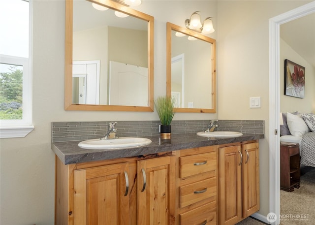 155 Triopha Ln, Sequim, WA 98382 - ensuite bathroom featuring double vanity and decorative backsplash