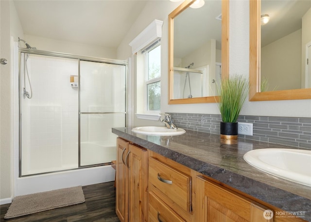 155 Triopha Ln, Sequim, WA 98382 - bathroom with an enclosed shower, double vanity, wood finished floors, and backsplash
