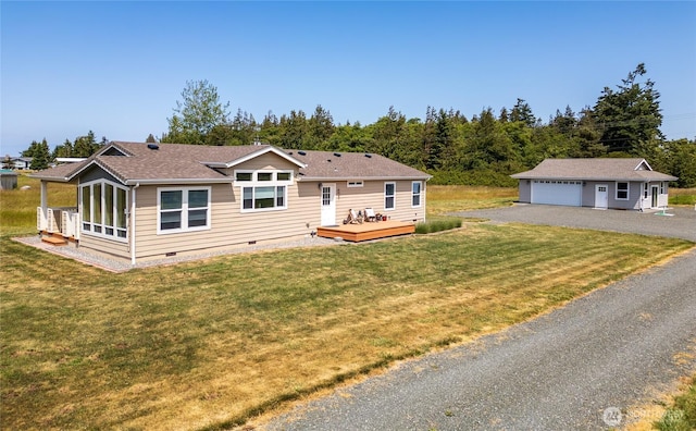 155 Triopha Ln, Sequim, WA 98382 - back of property with crawl space, an outdoor structure, a wooden deck, a detached garage, and a yard