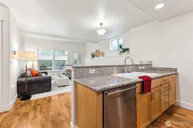 5907 40th Ave SW Unit B, Seattle, WA 98136 - kitchen featuring stainless steel dishwasher, a sink, light wood-style floors, a peninsula, and open floor plan