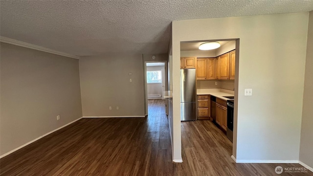3425 S 176th St Unit 136, Seatac, WA 98188 - kitchen featuring stainless steel appliances, a baseboard heating unit, dark wood-style flooring, a textured ceiling, and light countertops
